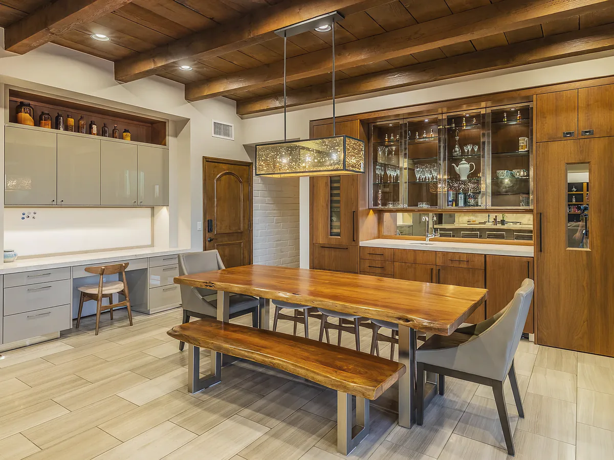 Dining room at Camino Antonio with a live-edge timber table under Douglas Fir beams